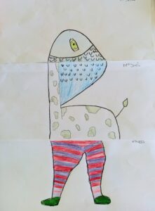 Neste cadáver esquisito, a figura tem cabeça de peixe, corpo de girafa e pernas gordas vestidas com uns collants às riscas.